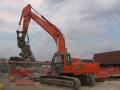 Hitachi Zaxis 350LCN con pinza