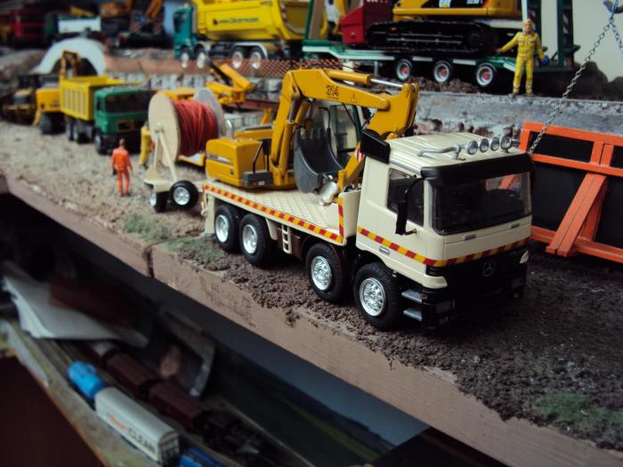 mb actros modificoto per scavi stradali con escavatore liheberr 314